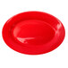 A crimson red stoneware platter with a wide rim.