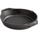 A black round Lodge cast iron grill pan with dual handles.