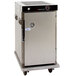 A large stainless steel Cres Cor holding cabinet with wheels.