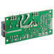 A green AvaValley circuit board with silver metal parts and two wires.