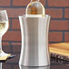 An American Metalcraft stainless steel hourglass shape wine cooler holding a wine bottle.