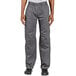A person wearing Uncommon Chef slate gray cargo chef pants.
