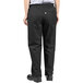 A woman wearing Uncommon Chef black chef pants.
