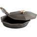 a black cast iron skillet with a lid