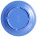 A blue plate with a circular design on the rim.