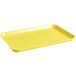 A yellow rectangular Cambro market tray with handles.