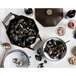 A bowl of mussels in a cast iron Dutch oven on a table.