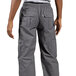 A person wearing Uncommon Chef slate gray cargo chef pants.