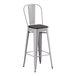 A Lancaster Table & Seating gray metal barstool with a black wood seat.