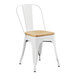 A white Lancaster Table & Seating metal cafe chair with a natural wood seat.