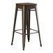 A brown metal Lancaster Table & Seating backless barstool with a walnut wood seat.