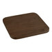 A Lancaster Table & Seating copper barstool with a walnut wood seat at a square wooden table.