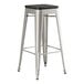 A Lancaster Table & Seating backless barstool with a black seat.