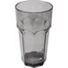 A clear Carlisle plastic tumbler with a black rim.