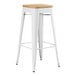 A white Lancaster Table & Seating backless barstool with a natural wood seat.