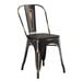 A black metal Lancaster Table & Seating cafe chair with a black wood seat.