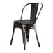 A Lancaster Table & Seating black metal chair with a black wood seat.