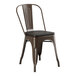 A brown Lancaster Table & Seating metal chair with a black wood seat.