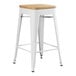 A white Lancaster Table & Seating backless counter height stool with a natural wood seat.