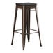 A brown Lancaster Table & Seating backless barstool with a black seat.