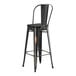 A black Lancaster Table & Seating barstool with a black wood seat.