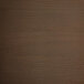 The walnut wood seat of a Lancaster Table & Seating indoor cafe barstool with scratches.
