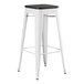 A white metal Lancaster Table & Seating backless barstool with a black wood seat.