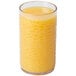 A Carlisle clear plastic tumbler filled with orange juice.