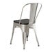 A Lancaster Table & Seating metal chair with a black wood seat.