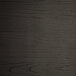 A black wood surface with a grainy pattern on a Lancaster Table & Seating indoor cafe chair.