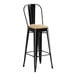 A Lancaster Table & Seating black metal barstool with a natural wood seat.