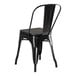 A Lancaster Table & Seating black metal chair with a black wood seat.