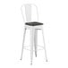 A white Lancaster Table & Seating barstool with a black wood seat.