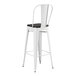 A white Lancaster Table & Seating metal cafe barstool with a black wood seat.