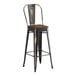 A black Lancaster Table & Seating bar stool with a walnut wood seat.