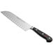 A Wusthof Classic Santoku knife with a black handle.