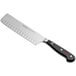 A Wusthof Classic Nakiri knife with a black handle.