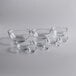 A group of clear glass Anchor Hocking mixing bowls.