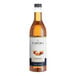 A close up of a bottle of Capora Caramel Flavoring Syrup with a white label.