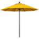 A close up of a yellow California Umbrella with a black pole.