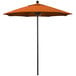 A California Umbrella ALTO round outdoor umbrella with a Tuscan Sunbrella canopy in orange.