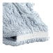 A close-up of a blue and white Carlisle wet mop head.