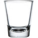 A clear Libbey shot glass with a white background.