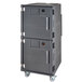 A grey plastic Cambro food holding cabinet on wheels with two doors.