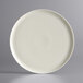 A Luzerne white porcelain coupe plate with a gray speckled rim.