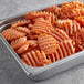 A container of McCain Harvest Splendor Sweet Potato Cross Trax Waffle Fries.