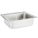 A stainless steel water pan for a chafer on a counter.