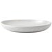 A close up of a matte pearl oval stoneware bowl on a white background.