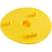 A yellow plastic disc with two holes.