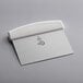 A white Mercer Culinary dough cutter with a silver blade.